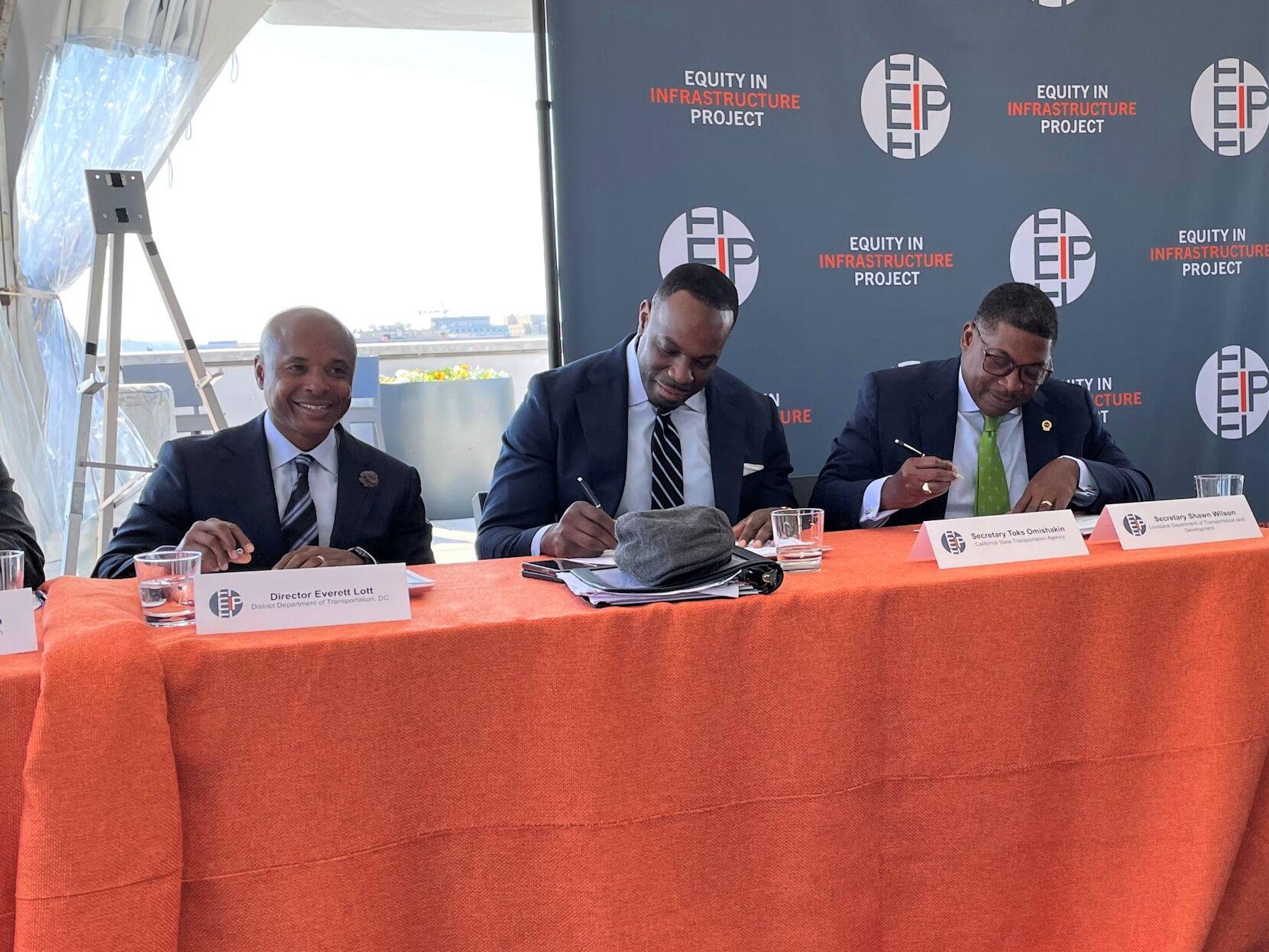Shawn Wilson, secretary of the Louisiana Department of Transportation and Development, on right, signs onto the Equity in Infrastructure Project on Tuesday, Oct. 11, 2022, along with heads of five other state transportation infrastructure agencies.
